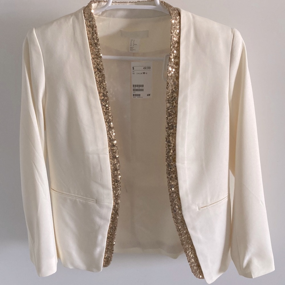 Cream colored jacket with gold sparkle sequin trim